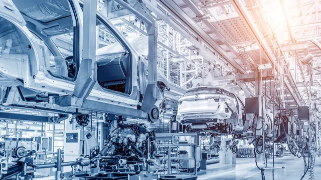 Vehicle bodies moving through an automotive production line